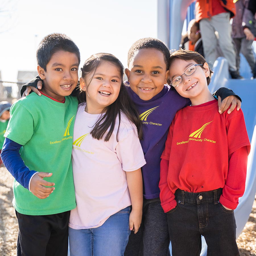 Children on playground wearing SOAR t-shirts